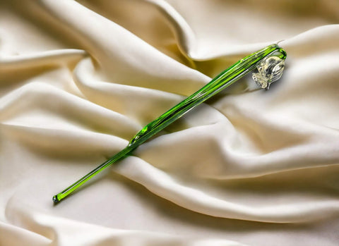 a close up of a flower on a white cloth